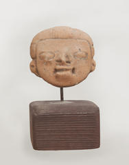 Small Face Mounted on Wood Base