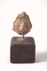 Small Face with Large Nose Mounted on Wood Base